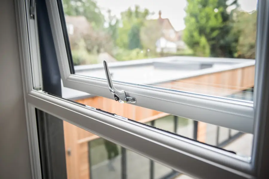 white casement windows in a brick house